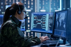 a woman officer locating a criminals whereabout through a software