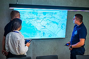 detectives using police software to find a criminal 